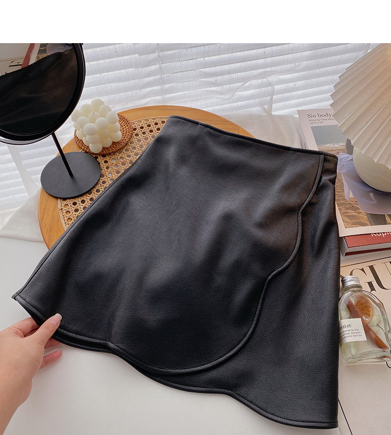 The new Korean design feels irregular and slim fashion PU leather skirt 5528