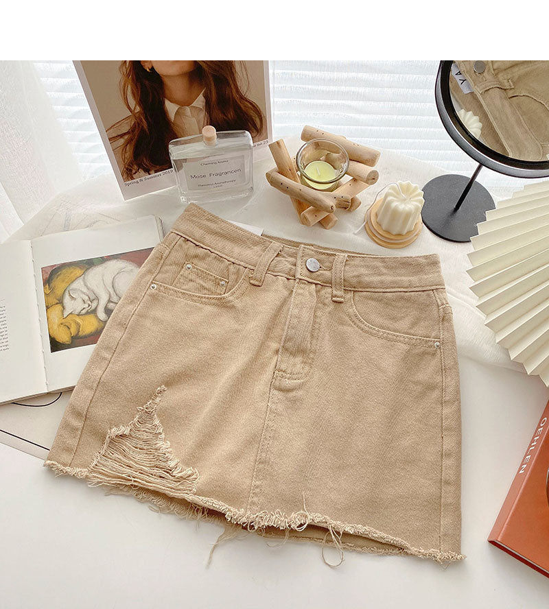 Korean version light proof personalized hole breaking high waist A-shaped skirt  5567