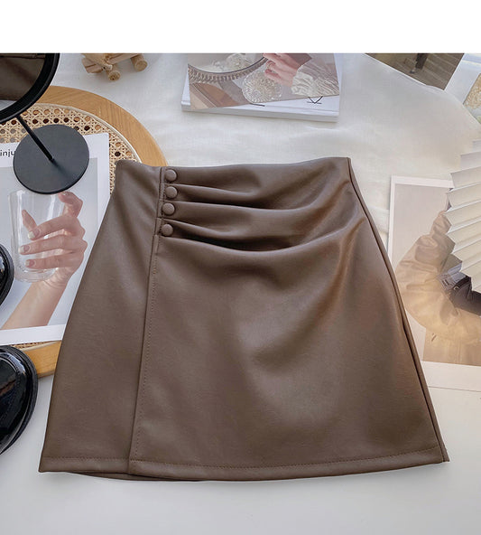 Solid color pleated PU leather short skirt for women is thin and versatile  5587