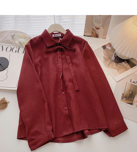 Haut simple boutonnage à lacets polyvalent de style étranger décontracté et doux de couleur unie 6351