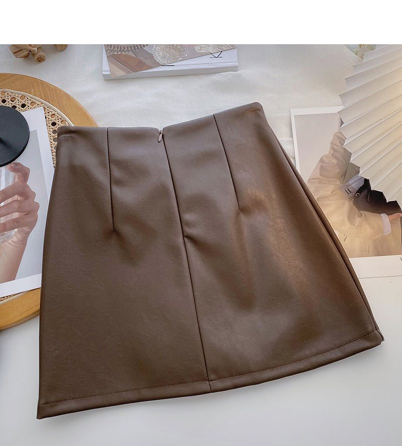 Solid color pleated PU leather short skirt for women is thin and versatile  5587